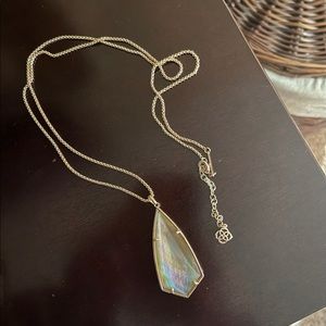 Long Kendra Scott necklace.